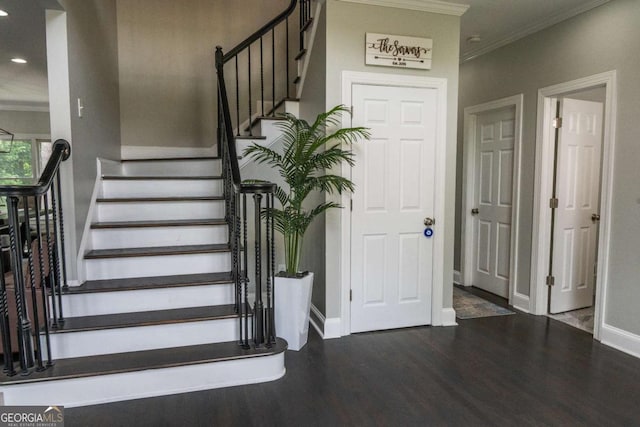 stairs featuring hardwood / wood-style flooring and crown molding