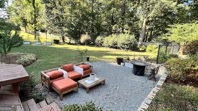 view of yard with an outdoor fire pit and a patio area