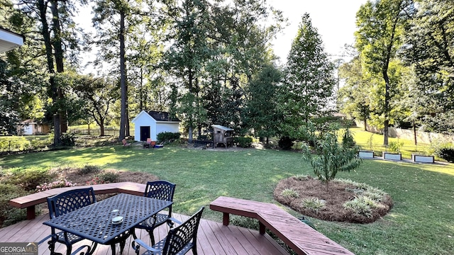 view of yard with an outdoor structure and a deck