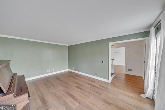 1706 Murphy Ln, Dublin, GA 31021 - unfurnished room featuring crown molding and wood finished floors