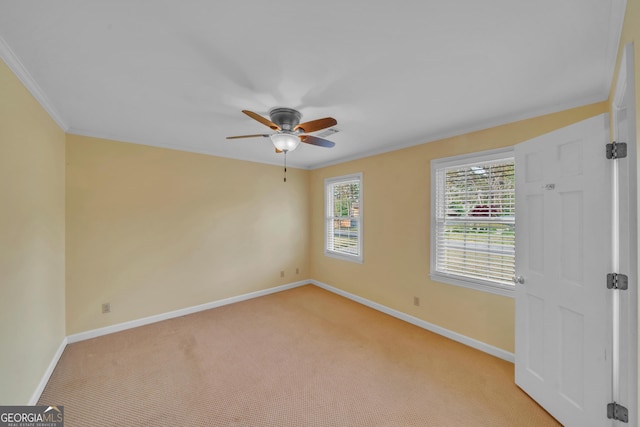 1706 Murphy Ln, Dublin, GA 31021 - spare room with ceiling fan, light colored carpet, and ornamental molding