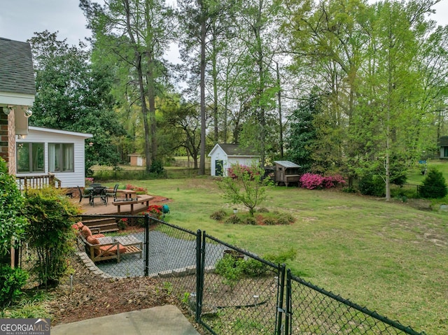 1706 Murphy Ln, Dublin, GA 31021 - view of yard featuring a storage shed, a gate, and a fire pit