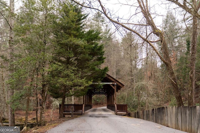 view of street featuring a forest view