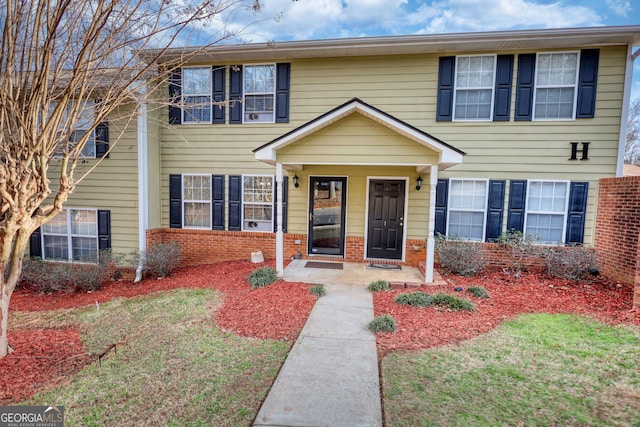 view of front of property featuring brick siding