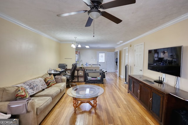 living room with light wood-style floors, crown molding, a textured ceiling, and ceiling fan