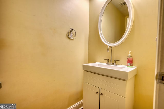 bathroom with visible vents and vanity