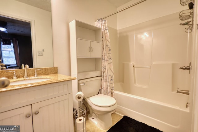 bathroom featuring shower / bath combination with curtain, tile patterned flooring, vanity, and toilet