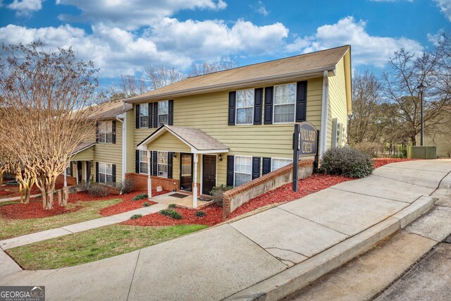 view of front of property featuring brick siding