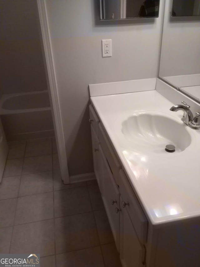 bathroom with vanity and tile patterned flooring