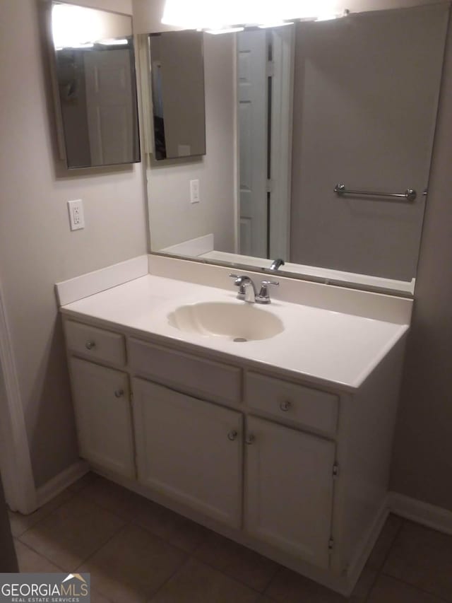 bathroom featuring vanity and tile patterned flooring