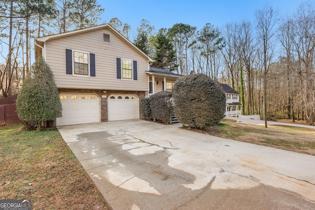 view of front of home featuring a garage and a front yard