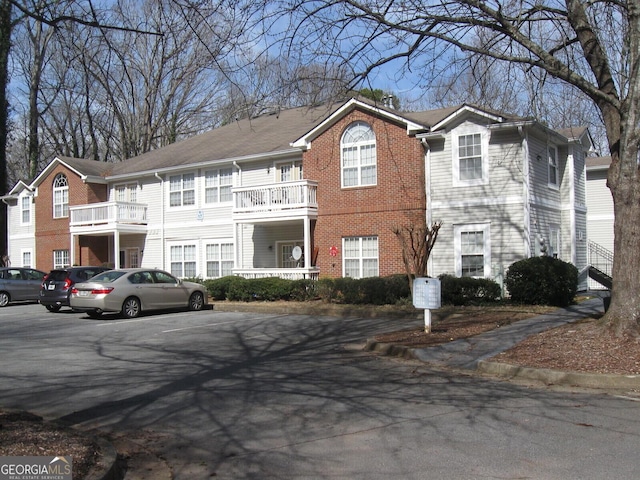 view of front of house featuring brick siding