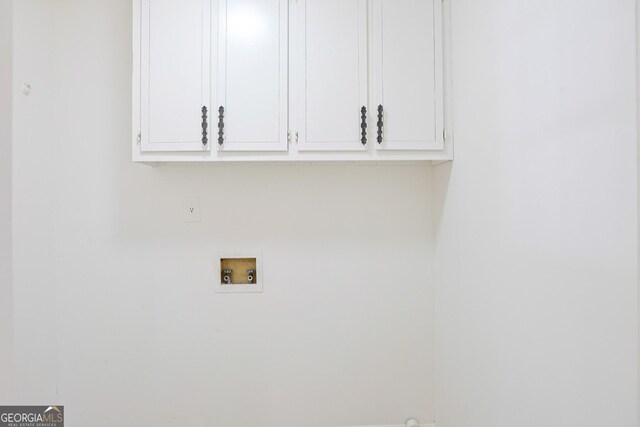 laundry area featuring washer hookup and cabinet space