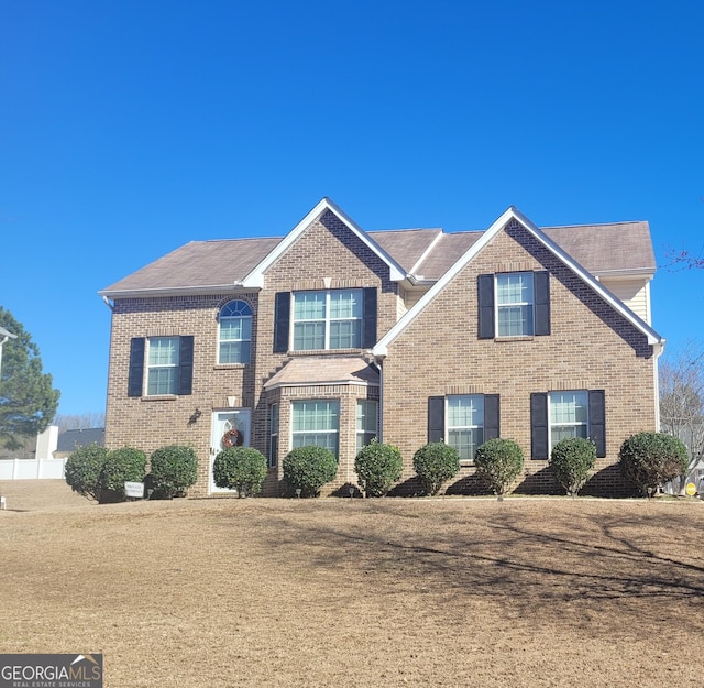 view of front of property with a front lawn