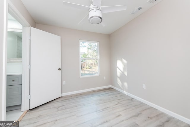 unfurnished room with ceiling fan and light hardwood / wood-style floors