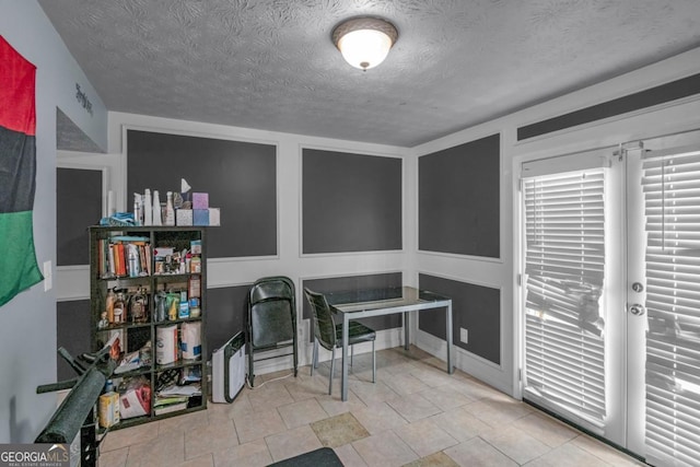 office space featuring a textured ceiling