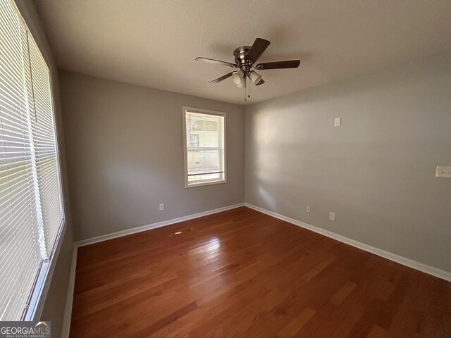 47 Elm St, Hampton, GA 30228 - unfurnished room featuring baseboards, a ceiling fan, and wood finished floors