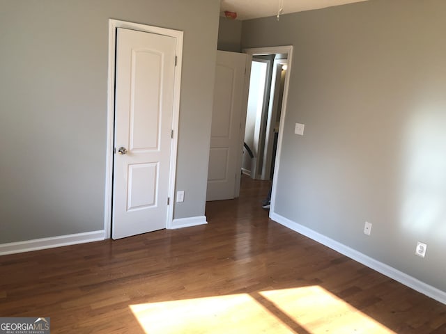 47 Elm St, Hampton, GA 30228 - unfurnished bedroom featuring wood finished floors and baseboards
