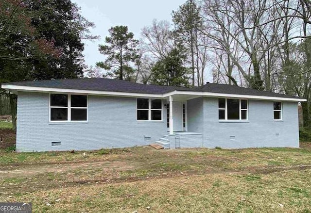 ranch-style home with brick siding, crawl space, and a front yard