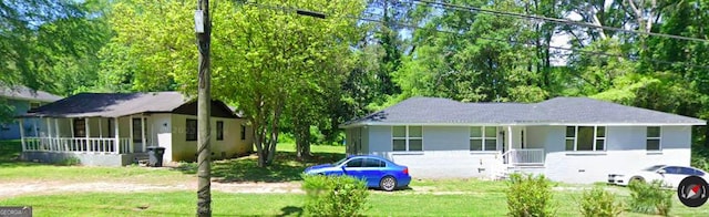 47 Elm St, Hampton, GA 30228 - view of front of house with a porch and a front yard