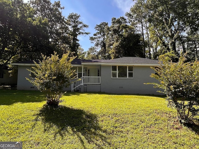 47 Elm St, Hampton, GA 30228 - view of front of house with brick siding, crawl space, and a front yard