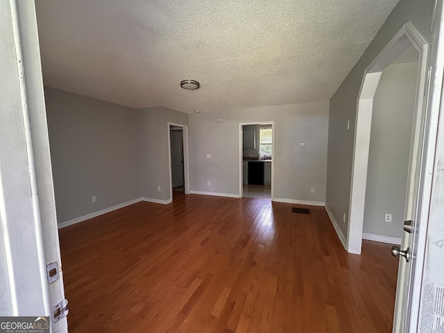 47 Elm St, Hampton, GA 30228 - spare room with a textured ceiling, wood finished floors, and baseboards