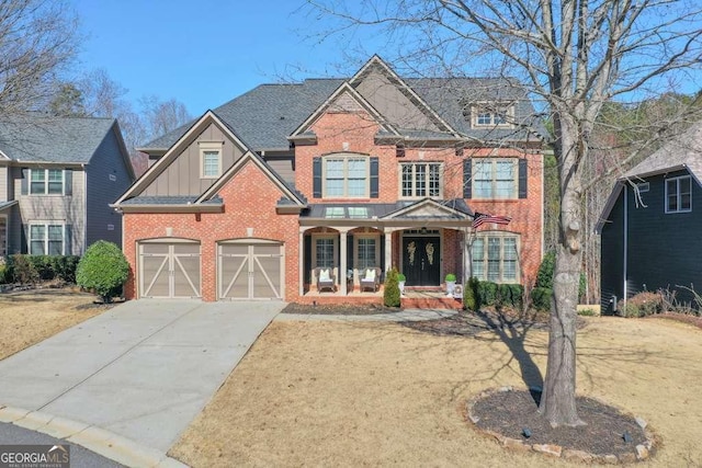 view of front of property featuring covered porch and a garage