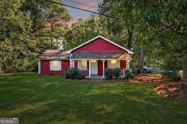 view of front facade featuring a yard and a porch