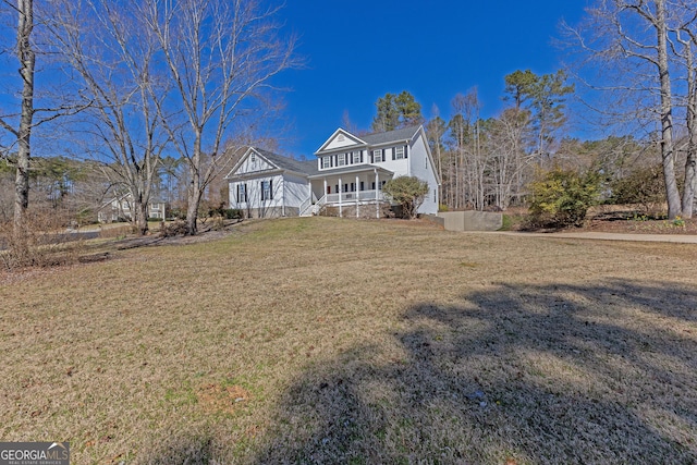 view of front of property featuring a porch and a front yard