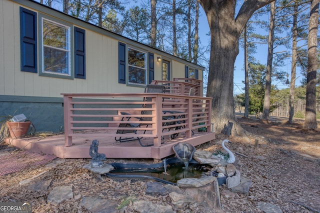 view of property exterior featuring a deck