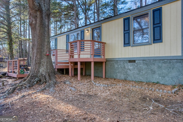 exterior space featuring a wooden deck