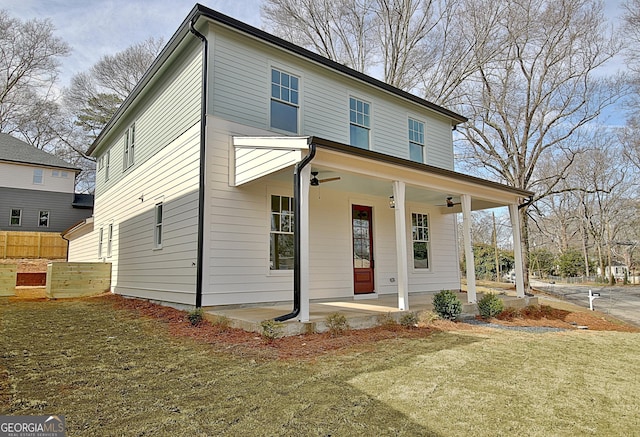 view of front of property with a front yard and a porch