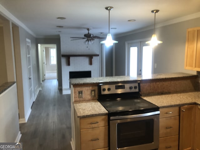 kitchen with a fireplace, stainless steel electric range, crown molding, dark hardwood / wood-style floors, and pendant lighting