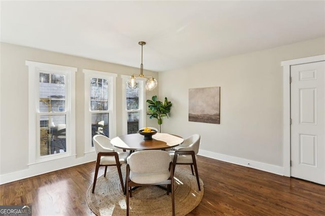 dining room with dark hardwood / wood-style floors