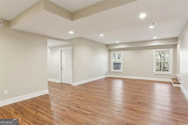 unfurnished living room with wood-type flooring