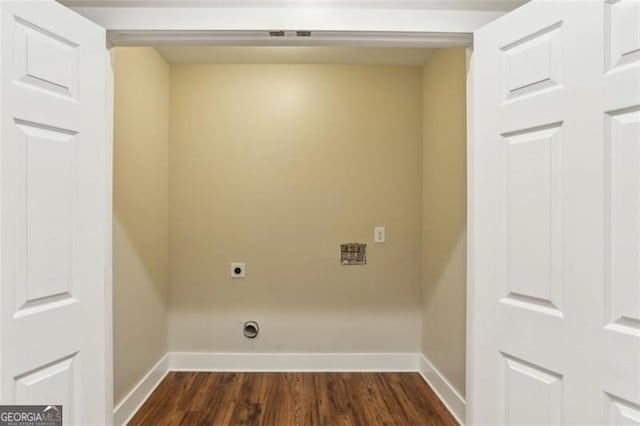 laundry room featuring dark hardwood / wood-style floors and electric dryer hookup