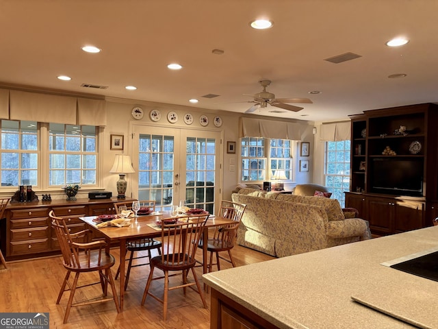 dining room featuring light wood-style flooring, visible vents, and recessed lighting