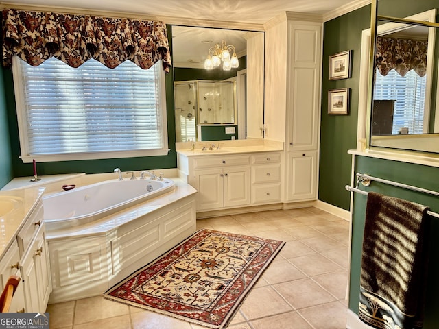 bathroom featuring vanity, a stall shower, tile patterned flooring, and a bath