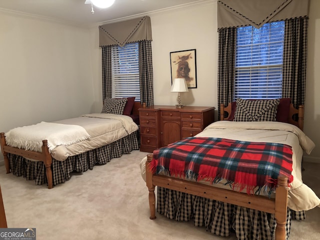 bedroom featuring crown molding and carpet flooring