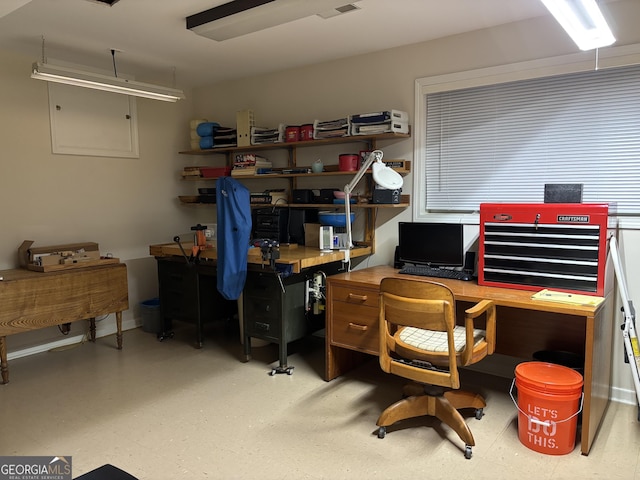 office area with a workshop area and tile patterned floors