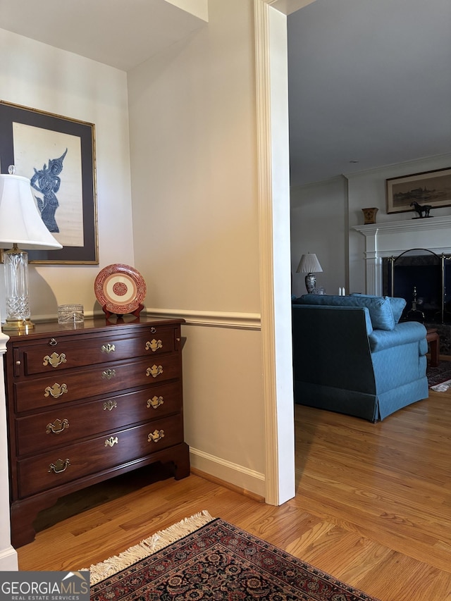 interior space featuring light wood finished floors and baseboards