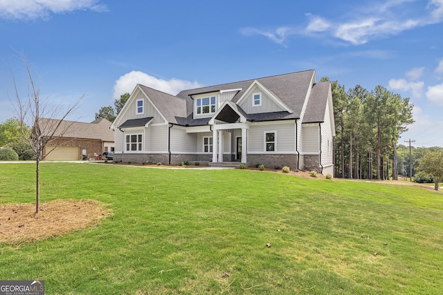 craftsman-style home with a front lawn and a garage