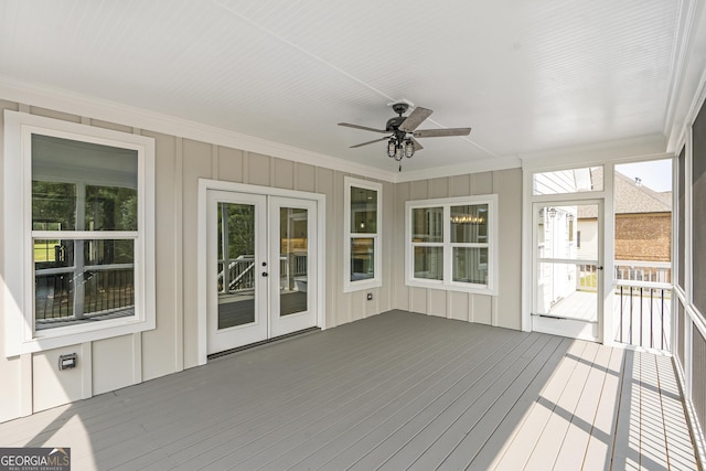 unfurnished sunroom featuring french doors and ceiling fan