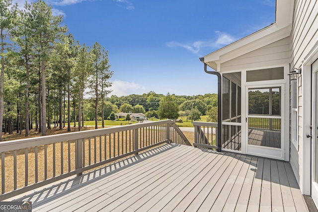 wooden terrace with a sunroom