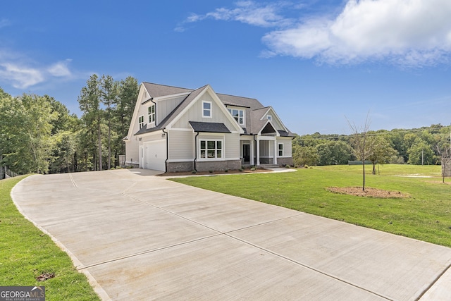 view of front of house with a garage and a front yard