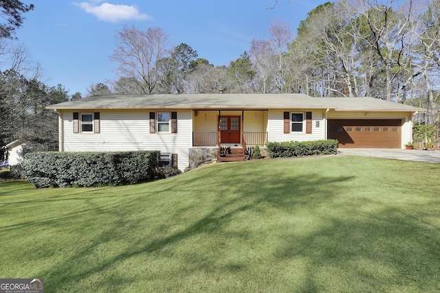 ranch-style house featuring a garage and a front lawn