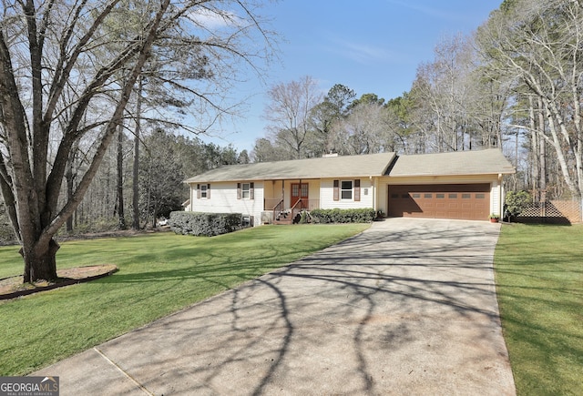 single story home featuring a garage and a front yard