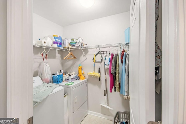 washroom featuring light tile patterned floors and separate washer and dryer