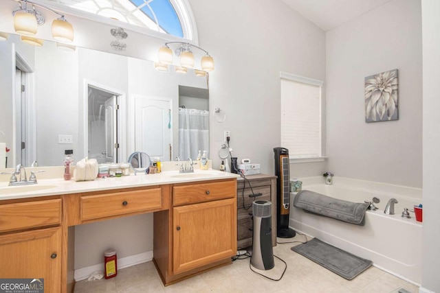 bathroom featuring vanity and a washtub