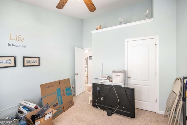 interior space with light carpet, high vaulted ceiling, and ceiling fan